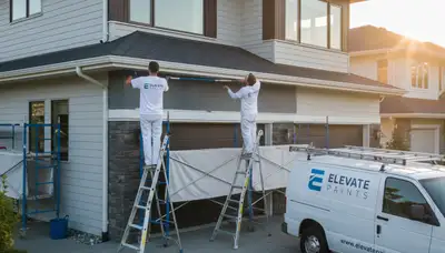 Professional gutter painting on coastal home exterior in Bradenton, FL for salt air protection