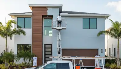 Professional house painters working on exterior home painting in Bradenton FL